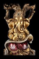 Ganesha Figur mit Schriftrolle unterm Baum