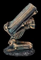 Skeleton Figurine Holding Spell Book