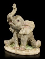 Elefanten Figur - Junges sitzend mit erhobenem Rüssel