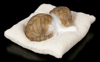 Cat Figurine asleep on white Blanket