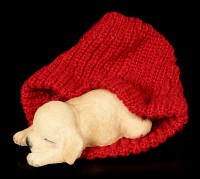 Dog Figurine asleep wrapped in red bobble Cap