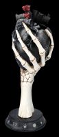 Skeleton Hand Holds Black Heart