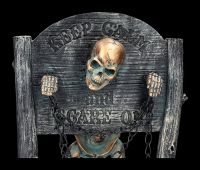 Skeleton Figurine in the Pillory