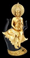 Buddha Figur sitzt auf Hand