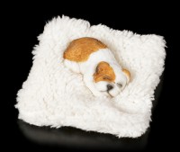 Kleine Hunde Figur schlafend auf Decke