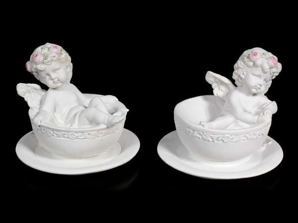 Two white Cherubim Figurines in Tea Cups