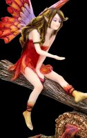 Fairy Figurine on Seesaw with red Dragon