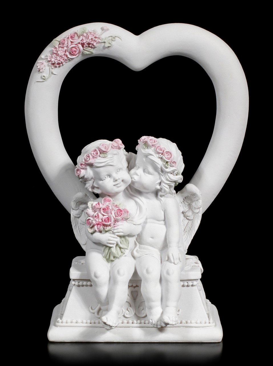 Two white Cherubim Figurines in front of a Heart