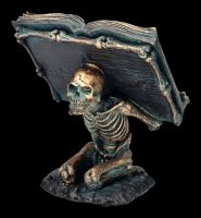 Skeleton Figurine Holding Spell Book