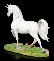 White Unicorn Figurine on Meadow