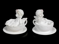 Two white Cherubim Figurines in Tea Cups