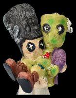 Pinheads Figur - Frankensteins Monster wird von Braut getragen