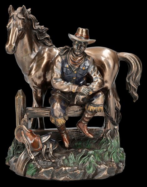 Cowboy Figur mit Pferd bei der Rast