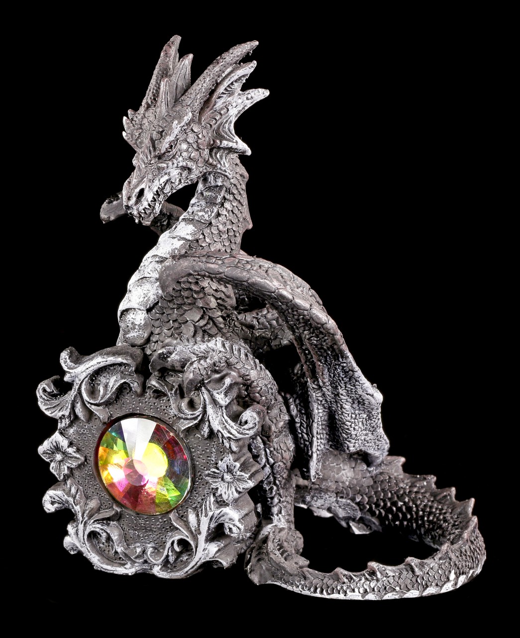 Black Dragon Figurine sitting behind a Crystal