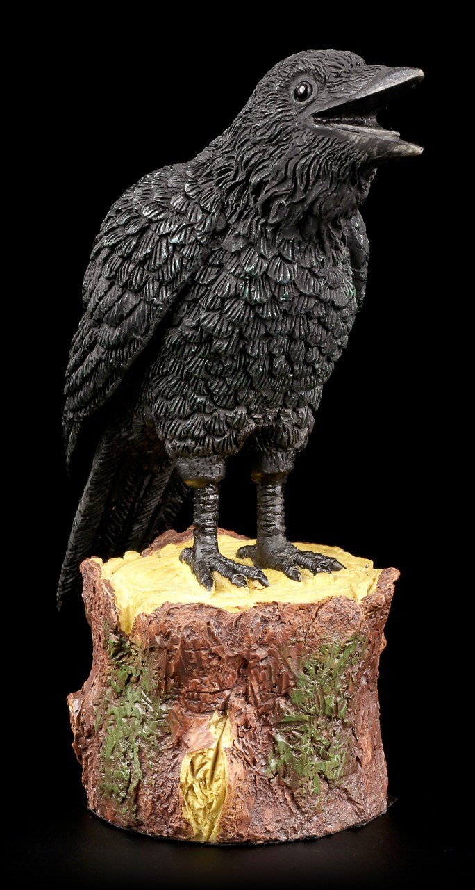 Ravens Figurine standing on Tree Stump