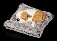 Dog Figurine asleep on grey Blanket