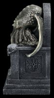 Cthulhu Figurine sits on Throne