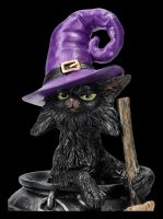 Hexen-Katzen-Figur sitzt in Zauberkessel