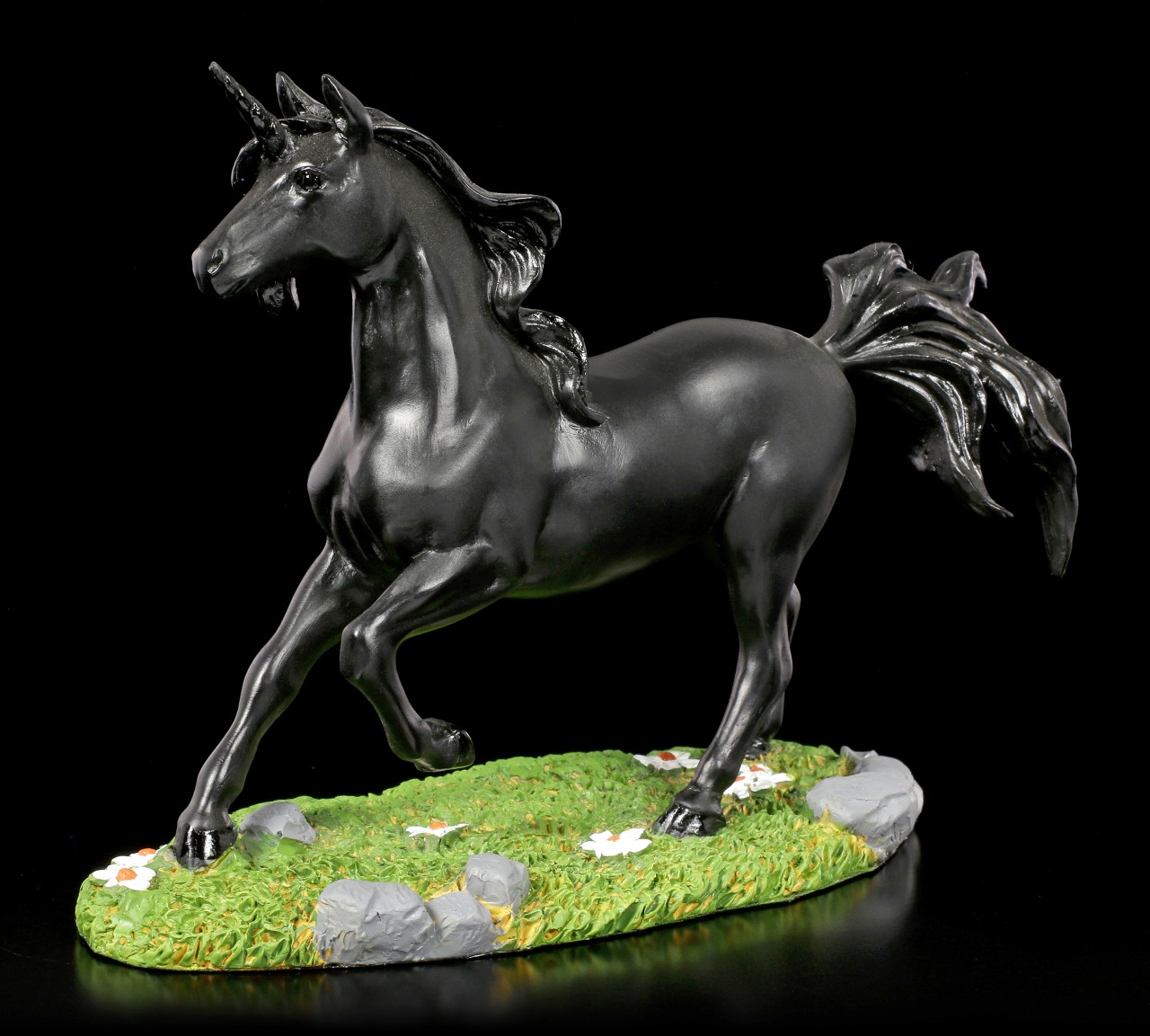 Black Unicorn Figurine on Meadow