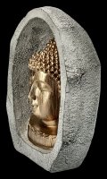Goldfarbener Buddha Kopf im Stein