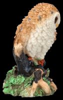 Owl Figurine sitting sceptically on branch
