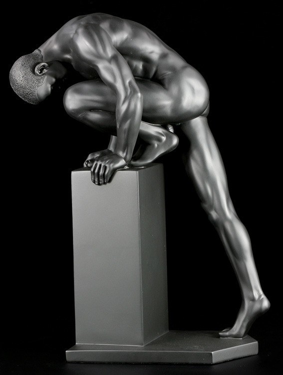 Male Nude Figurine Climbs Pedestal