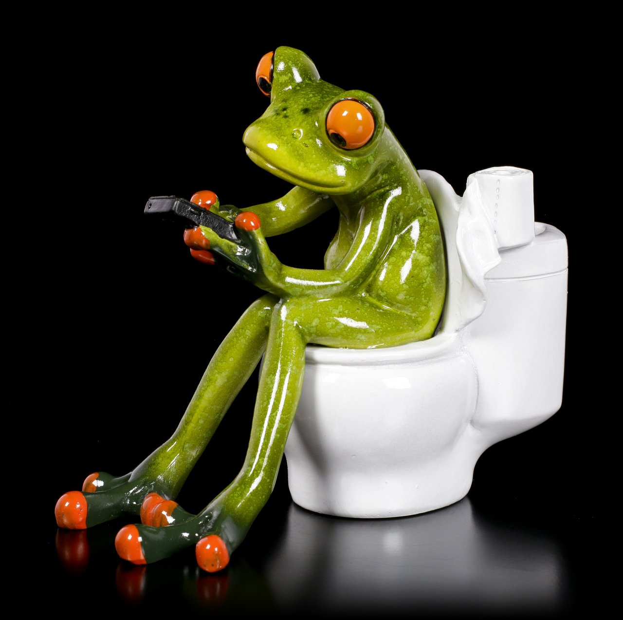 Lustige Frosch Figur auf Toilette