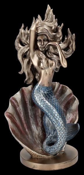 Mermaid Figurine in Front of a Shell
